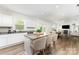 The kitchen features an island with barstool seating, granite countertops, and stainless steel appliances at 3077 Light Ridge Sw Ct, Concord, NC 28027