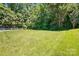Beautiful backyard with lush green grass and a white fence at 3106 Crosswind Dr, Fort Mill, SC 29707