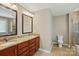 Bathroom featuring a double-sink vanity with granite countertop and a walk-in shower at 3106 Crosswind Dr, Fort Mill, SC 29707
