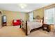 Spacious bedroom with a cozy sitting area and ample natural light at 3106 Crosswind Dr, Fort Mill, SC 29707