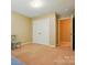 Bedroom featuring neutral walls, a chair, closet and tan carpet flooring at 3106 Crosswind Dr, Fort Mill, SC 29707