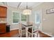 Cozy dining area with modern lighting, hardwood floors, and easy access to the kitchen at 3106 Crosswind Dr, Fort Mill, SC 29707