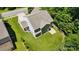An elevated view showcases the home's backyard, fenced perimeter, and rear patio, perfect for outdoor relaxation at 3106 Crosswind Dr, Fort Mill, SC 29707