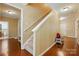 Hallway with hardwood floors and a carpeted staircase at 3106 Crosswind Dr, Fort Mill, SC 29707