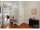 Inviting hallway with hardwood floors, a cozy bench, and stylish decor leading to other living spaces at 3106 Crosswind Dr, Fort Mill, SC 29707