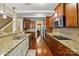 Modern kitchen with granite countertops, stainless steel appliances, hardwood floors, and ample cabinet space at 3106 Crosswind Dr, Fort Mill, SC 29707