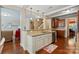 Bright kitchen featuring granite countertops, stainless steel appliances, and an open view to living area at 3106 Crosswind Dr, Fort Mill, SC 29707