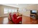 Comfortable living room with hardwood floors, neutral paint, and a bright window at 3106 Crosswind Dr, Fort Mill, SC 29707