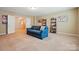 Spacious living room with a comfortable blue sofa and charming decor at 3106 Crosswind Dr, Fort Mill, SC 29707