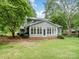 Well maintained home with spacious back yard and a large sunroom at 3327 Archdale Dr, Charlotte, NC 28210