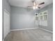 Light-filled bedroom with neutral walls, carpet, and large closet at 3327 Archdale Dr, Charlotte, NC 28210