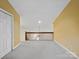 Spacious upper bonus room with neutral walls, carpet, and natural light from the stairwell railing at 3327 Archdale Dr, Charlotte, NC 28210