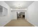 View of dining room with chandelier, and a glimpse of the entryway and living room at 3327 Archdale Dr, Charlotte, NC 28210