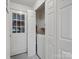 Convenient laundry room with washer, folding door, and exterior door at 3327 Archdale Dr, Charlotte, NC 28210