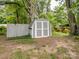Neat storage shed in backyard provides organized outdoor storage space for tools and equipment at 3327 Archdale Dr, Charlotte, NC 28210