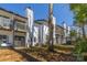 Townhouse backyard with patios, decks and mature tree; view is partly obscured at 3615 Maple Glenn Ln, Charlotte, NC 28226