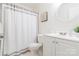 Well-lit bathroom featuring a shower-tub combo and a vanity with storage space at 3615 Maple Glenn Ln, Charlotte, NC 28226