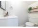 Bathroom featuring modern sink, vanity, mirror, and toilet at 3615 Maple Glenn Ln, Charlotte, NC 28226