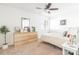 Bright bedroom featuring a ceiling fan, neutral color palette, and a large window at 3615 Maple Glenn Ln, Charlotte, NC 28226
