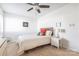 Bright bedroom featuring a ceiling fan, neutral color palette, and a large window at 3615 Maple Glenn Ln, Charlotte, NC 28226