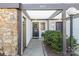 Inviting front entrance featuring stone accents, neutral siding, and well-maintained landscaping at 3615 Maple Glenn Ln, Charlotte, NC 28226