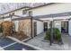 Charming townhome featuring a stone facade and inviting front entrance with landscaped garden at 3615 Maple Glenn Ln, Charlotte, NC 28226