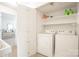 Laundry room with washer, dryer, storage shelves, and plenty of space at 3615 Maple Glenn Ln, Charlotte, NC 28226