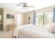 Comfortable bedroom with a large window, ceiling fan, and dressing area at 3615 Maple Glenn Ln, Charlotte, NC 28226