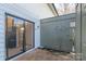 Cozy brick patio with sliding glass door to kitchen and unique fence at 3615 Maple Glenn Ln, Charlotte, NC 28226