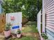 Picturesque backyard entrance with a white picket fence and lush green grass at 408 S Ellis St, Salisbury, NC 28144