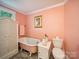 Charming bathroom with a clawfoot tub, vintage fixtures, and soft lighting, creating a relaxing space at 408 S Ellis St, Salisbury, NC 28144