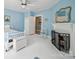 Cozy bedroom features a fireplace, light blue walls, and a comfortable atmosphere at 408 S Ellis St, Salisbury, NC 28144