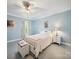 Bedroom with paneled walls, a bed, and soft, natural lighting at 408 S Ellis St, Salisbury, NC 28144