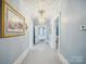 Hallway with light blue walls, white trim, and decorative lighting at 408 S Ellis St, Salisbury, NC 28144