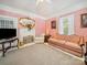 Cozy living room with a fireplace, vintage furniture, and soft lighting, creating a warm ambiance at 408 S Ellis St, Salisbury, NC 28144