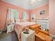 Comfortable main bedroom featuring vintage furniture and soft lighting, creating a relaxing retreat at 408 S Ellis St, Salisbury, NC 28144