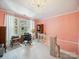 Bright and airy office with a large window, desk, and elegant chandelier lighting at 408 S Ellis St, Salisbury, NC 28144