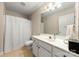Bathroom with a shower, vanity, light paint, and light-colored floor tile at 4460 Coventry Row Ct, Charlotte, NC 28270