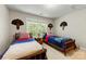 Bedroom featuring two beds, light paint, and a window for natural light at 4460 Coventry Row Ct, Charlotte, NC 28270