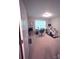 Functional bedroom featuring a desk, an exercise bike, and a window providing natural light at 4460 Coventry Row Ct, Charlotte, NC 28270