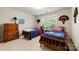 Bedroom featuring two beds, light paint, and a window for natural light at 4460 Coventry Row Ct, Charlotte, NC 28270