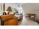 Bedroom with window, desk, television, bench, soft carpet, and a ceiling fan at 4460 Coventry Row Ct, Charlotte, NC 28270