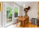 Sunny dining area with a wooden table and chairs, and view to the outside at 4460 Coventry Row Ct, Charlotte, NC 28270