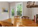 Cozy dining area with natural lighting, rustic decor, and hardwood flooring at 4460 Coventry Row Ct, Charlotte, NC 28270
