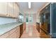 Modern kitchen with stainless steel appliances, granite countertops, and ample cabinet space at 4460 Coventry Row Ct, Charlotte, NC 28270