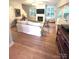 Inviting living room featuring hardwood floors, a cozy fireplace, and a comfortable seating area at 4460 Coventry Row Ct, Charlotte, NC 28270