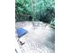 Outdoor patio area with a round table, chairs, and a fire pit in a shaded backyard setting at 4460 Coventry Row Ct, Charlotte, NC 28270