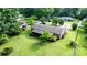 Aerial perspective highlighting the home's backyard, mature trees, and landscaped areas at 518 W School St, Maiden, NC 28650