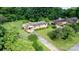 Property featuring a long driveway and a well-maintained yard, surrounded by mature trees at 518 W School St, Maiden, NC 28650