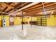 Spacious unfinished basement provides plenty of storage, as well as a utility sink and water heater at 518 W School St, Maiden, NC 28650